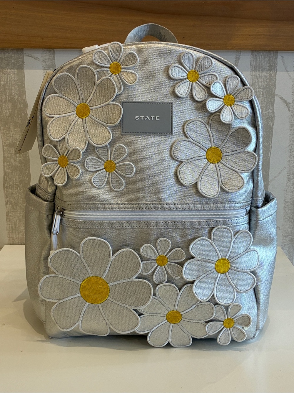STATE Silver Backpack with Yellow-Centered Daisy Appliqués